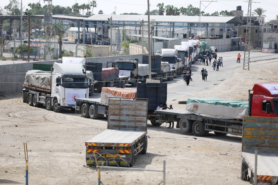 Trucks loaded with humanitarian aid enter Gaza through the Rafah border crossing on October 21, 2023—Xinhua Photo