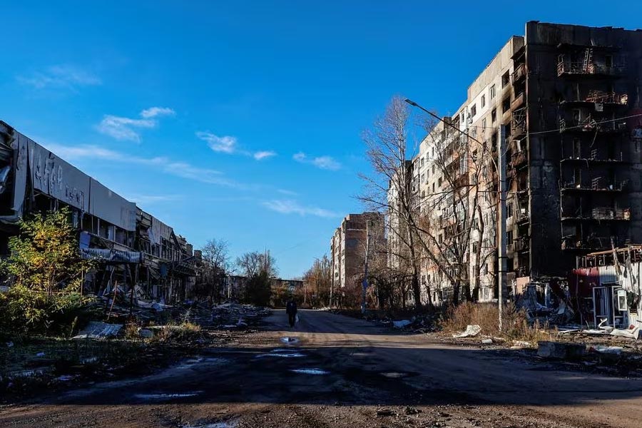 A local resident walking next to residential buildings heavily damaged by Russian military strikes in the front line town of Avdiivka in Donetsk region of Ukraine on November 8 this year –Reuters file photo