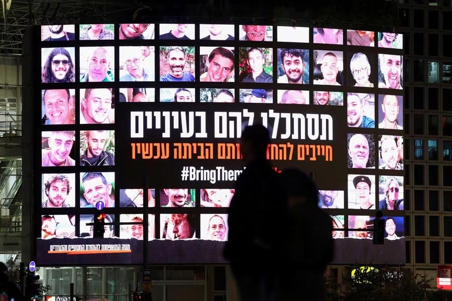 A screen displaying photos of people, who were abducted by Hamas during the October 7 attack, in Tel Aviv of Israel on last November 27 –Reuters file photo