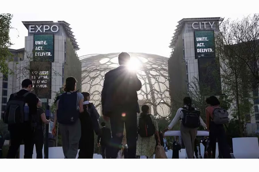 Attendees arrive for the opening of the UN's COP28 climate summit in Dubai, United Arab Emirates, Nov 30, 2023. REUTERS