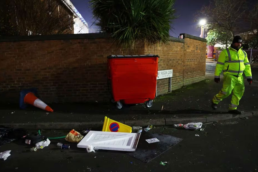 Soccer Football - Europa Conference League - Group E - Aston Villa v Legia Warsaw - Villa Park, Birmingham, Britain - November 30, 2023 A worker outside the stadium cleans up after the pre-match disturbances with the Legia Warsaw fans. Action Images via Reuters/Carl Recine/ File photo Acquire Licensing Rights