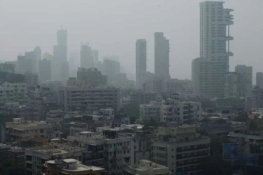 A general view of high-rise residential buildings amidst other residential buildings in Mumbai, India, Dec 1, 2023.