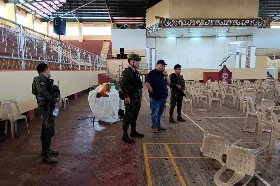 Law enforcement officers investigating the scene of an explosion that occurred during a Catholic Mass in a gymnasium at Mindanao State University in Marawi in Philippines on Sunday –Reuters photo
