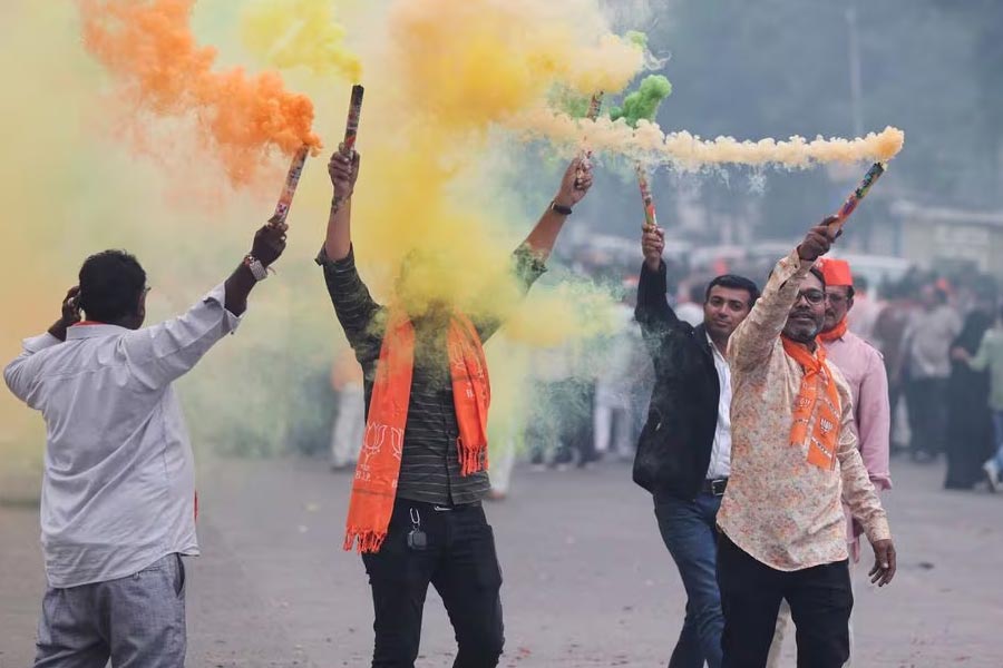 Supporters of India’s ruling Bharatiya Janata Party (BJP) celebrating after winning three out of four states in key regional polls outside the party headquarters in Ahmedabad of India on Sunday –Reuters photo