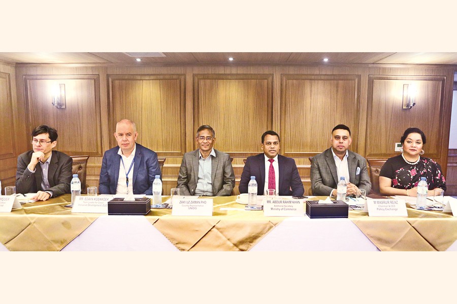 Participants at a workshop on 'Advancing circular textiles policies in Bangladesh' jointly organised by Chatham House and Policy Exchange Bangladesh in the city on Tuesday. Zaki Uz Zaman, country representative of UNIDO, Edwin Koekkoek, team leader for Green Inclusive Development, EUD, and Masrur Reaz, chairman and CEO of Policy Exchange, were present. — FE photo