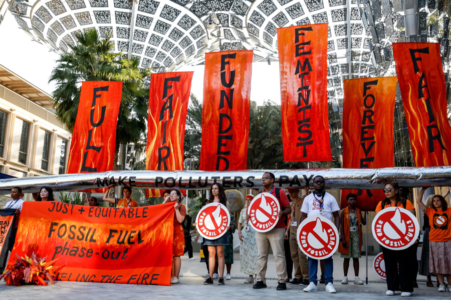 Participants stage a protest calling to phase out fossil fuels during the COP28 climate talks in Dubai—Agency Photo