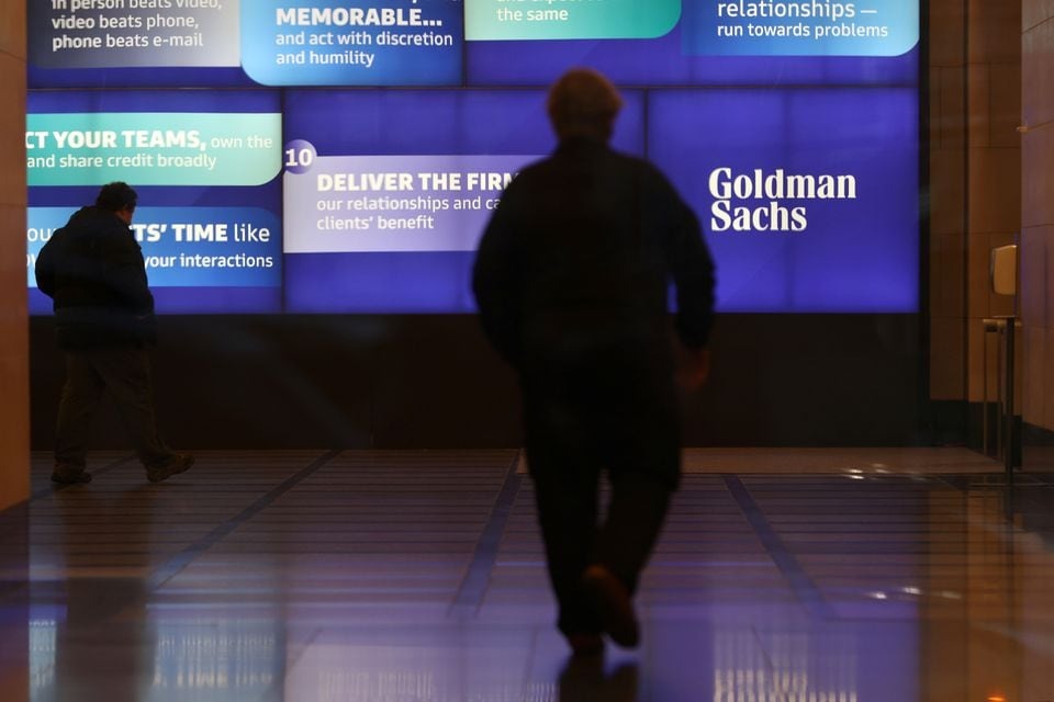 People walk in the Goldman Sachs global headquarters in Manhattan, New York, US, November 15, 2021.