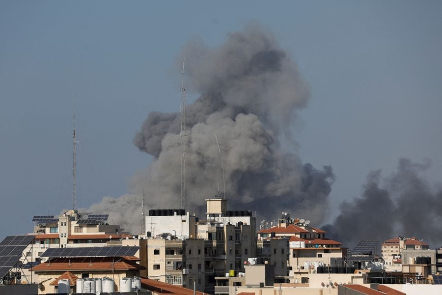 Smoke rises following Israeli strikes in Gaza, October 12, 2023.