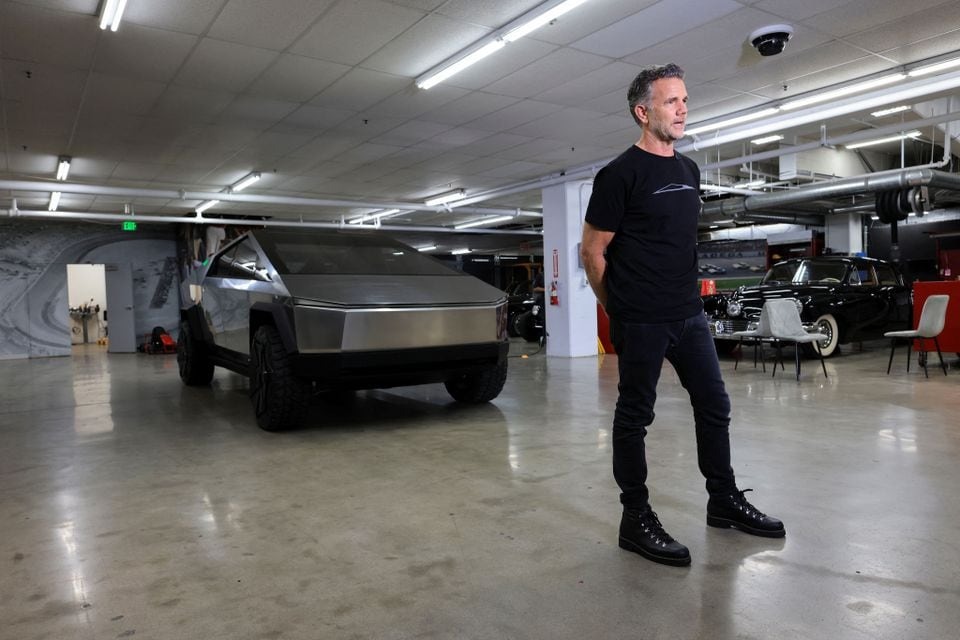 Tesla's chief designer Franz von Holzhausen poses next to a Tesla prototype at the Petersen Automotive Museum in Los Angeles, California, US on December 21, 2023 — Reuters photo