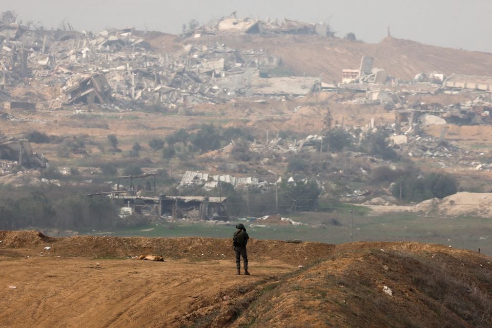 An Israeli soldier stands near the Israel-Gaza border, amid the ongoing conflict between Israel and the Palestinian Islamist group Hamas, in southern Israel on December 27, 2023 — Reuters photo