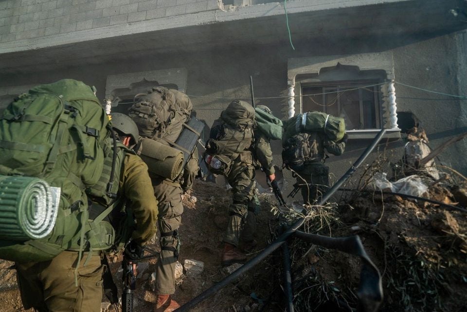 Israeli soldiers operate in the Gaza Strip amid the ongoing conflict between Israel and the Palestinian Islamist group Hamas, in this handout picture released on December 28, 2023 — Israel Defense Forces/Handout via REUTERS