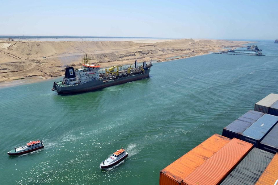 A cargo ship is seen crossing through the New Suez Canal, Ismailia, Egypt, July 25, 2015.