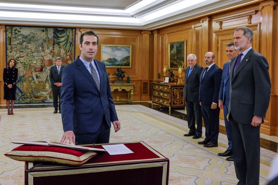 Newly appointed Minister for Economy, Trade and Companies, Carlos Cuerpo takes an oath of office next to Spain's King Felipe and Prime Minister Pedro Sanchez during a ceremony at Zarzuela Palace in Madrid, Spain on December 29, 2023 — Pool via REUTERS