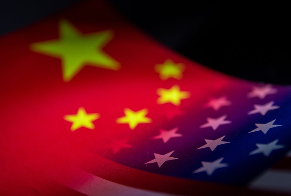 China's and US' flags are seen printed on paper in this illustration taken January 27, 2022. REUTERS/Dado Ruvic/Illustration/file photo
