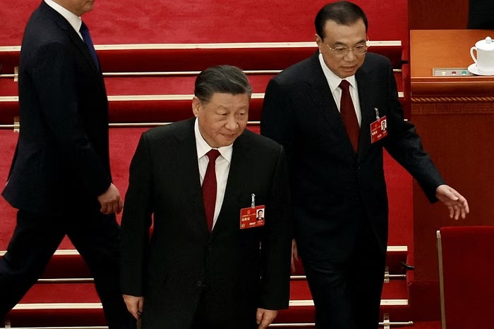 Chinese President Xi Jinping and Premier Li Keqiang arrive for the opening session of the National People's Congress (NPC) at the Great Hall of the People in Beijing, China March 5, 2023.