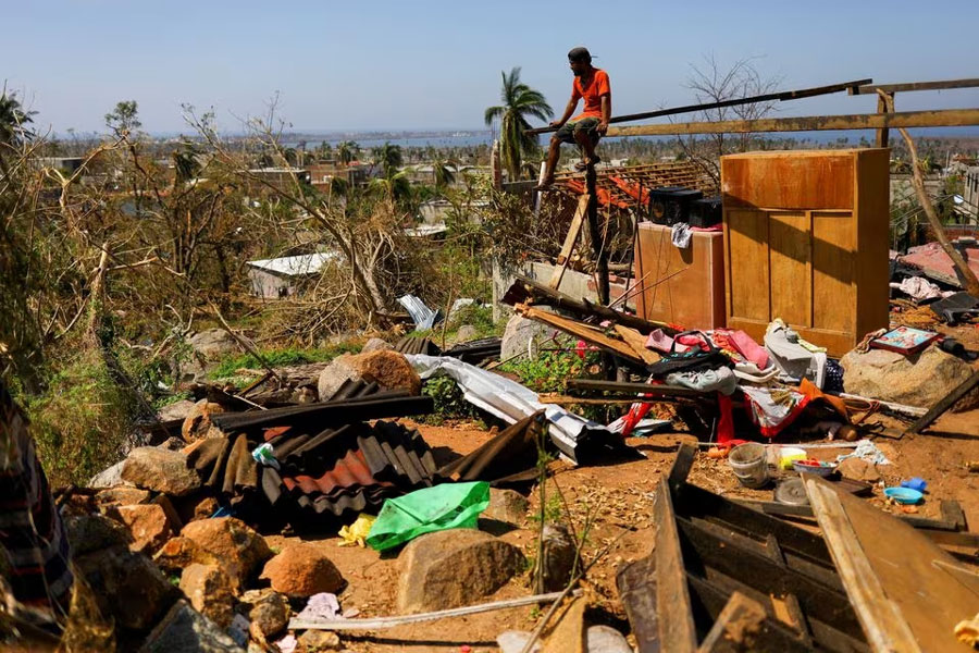 Oscar Petrona, 23, takes a break while making repairs to his house damaged by Hurricane Otis, in the El Pedregoso neighborhood, in Acapulco, Mexico, November 2, 2023. REUTERS/Jose Luis Gonzalez/File Photo Acquire Licensing Rights