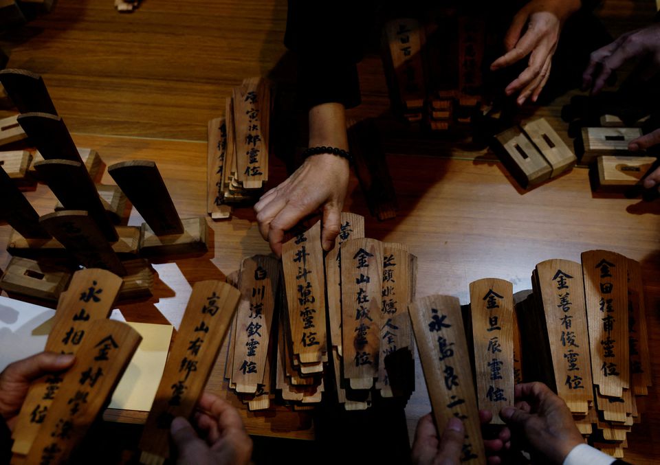 South Korean relatives of workers killed in a disaster at the Chosei coal mine, sort out ancestral tablets for the victims at a temple in Ube, Yamaguchi Prefecture, Japan, February 4, 2023. REUTERS/Kim Kyung-Hoon