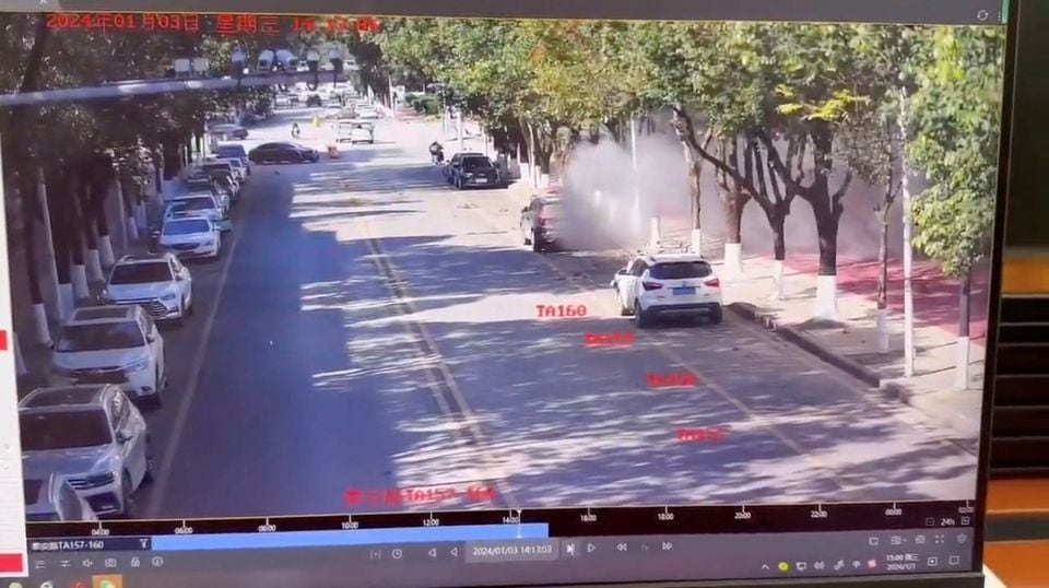 Smoke spreads on a road following an explosion after artillery shells fell in Nansan, Yunnan Province, China, in this screengrab obtained from a video of surveillance footage, released on January 3, 2024. Video Obtained By Reuters/via REUTERS
