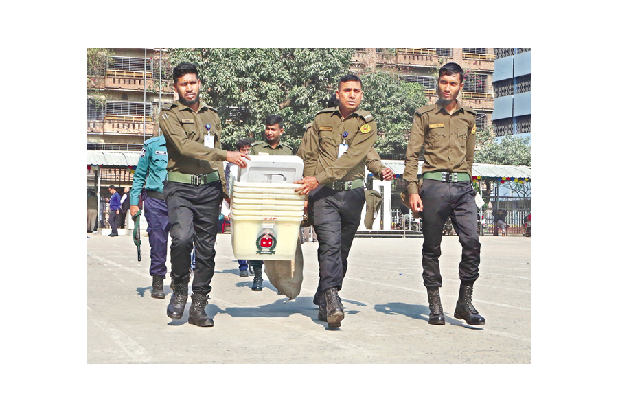 Ansar members carry ballot boxes and other election materials for transportation to various polling centres in the city on Saturday. This photo was taken at Willes Little Flower School and College at Kakrail from where these materials were being distributed. — FE photo
