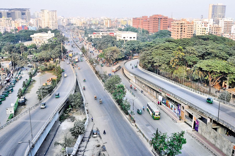Capital Dhaka wears a deserted look as a large chunk of its population leaves for their native homes centring the 12th parliamentary election scheduled for today (Sunday). The photo was taken from the northern slope of the Rumpura uloop in the city on Saturday