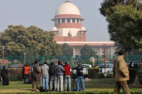 Television journalists are seen outside the premises of the Supreme Court in New Delhi, India, January 22, 2020. REUTERS/Anushree Fadnavis/File Photo