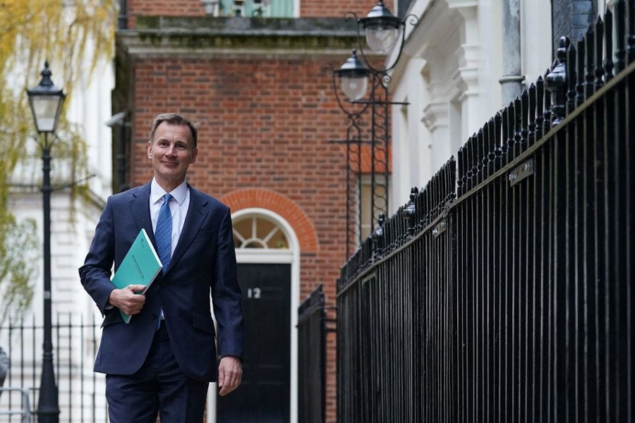 Chancellor of the Exchequer Jeremy Hunt leaves 11 Downing Street for the House of Commons to deliver his autumn statement, in London, Britain, November 22, 2023.
