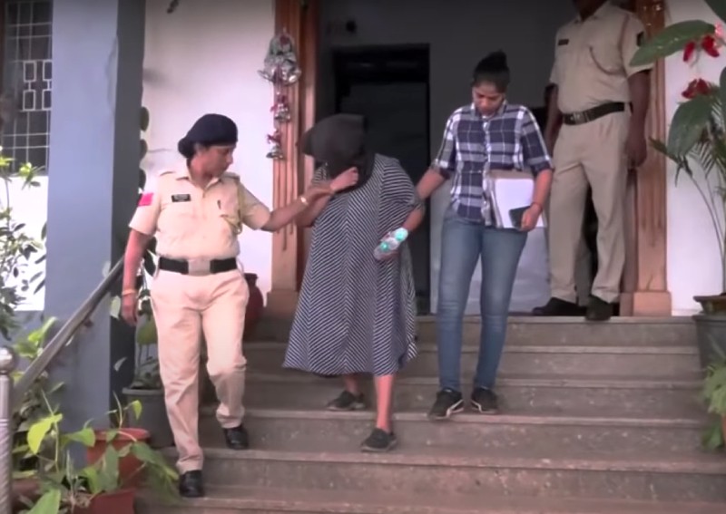 Suchana Seth (centre) being led out by police. PHOTO: Screengrab/YouTube/Reuters via asiaone.com