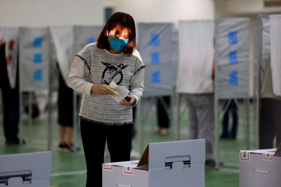 A woman prepares to cast her ballot at a polling station during the presidential and parliamentary elections in Tainan, Taiwan on January 13, 2024 — Reuters photo