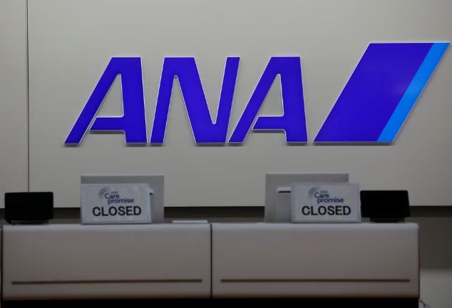 The logo of All Nippon Airways (ANA) is seen on its counter amid the coronavirus disease (COVID-19) outbreak, at a terminal of the Tokyo International Airport, commonly known as Haneda Airport, in Tokyo, Japan October 27, 2020. REUTERS/Kim Kyung-Hoon/File photo