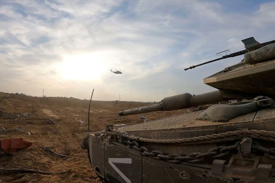 An Israeli military vehicle operates at a location given as the Gaza Strip amid the ongoing conflict between Israel and the Palestinian Islamist group Hamas, in this screen grab obtained from a video released on January 8, 2024 — Israel Defense Forces/Handout via REUTERS/Files