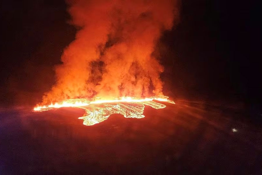 A volcano spews lava and smoke as it erupts in Reykjanes Peninsula, Iceland, January 14, 2024. Iceland Civil Protection/Handout via REUTERS Acquire Licensing Rights