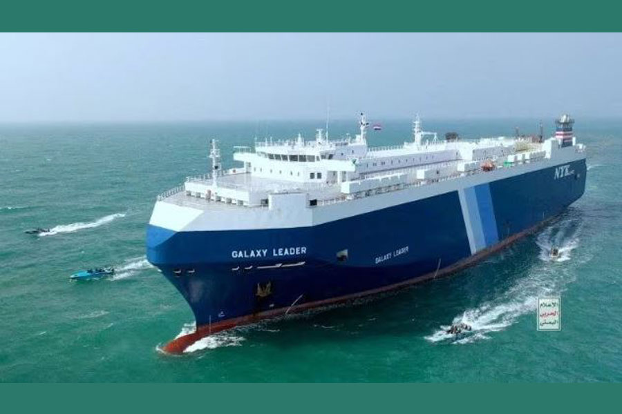 The Galaxy Leader cargo ship is escorted by Houthi boats in the Red Sea in this photo released November 20, 2023. Houthi Military Media/Handout via REUTERS/File Photo