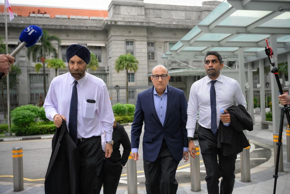 S. Iswaran, Singapore's former transport minister, arrives at the State Courts with his legal team, including Senior Counsel Davinder Singh (L), in Singapore, January 18, 2024. Mark Cheong/THE STRAITS TIMES/Handout via REUTERS