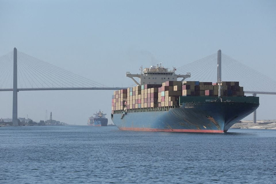 A container ship is seen near Suez Canal Bridge which is known as the "Peace Bridge" following a Suez Canal tugboat sinking yesterday after colliding with a Hong Kong-flagged LPG tanker in the waterway of the Suez Canal, Egypt, August 6, 2023.