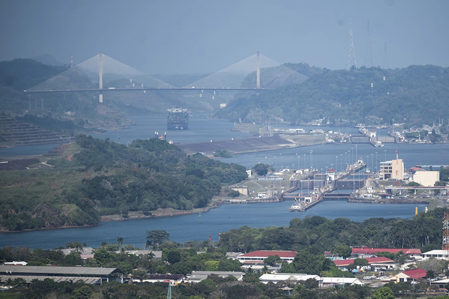 A cargo ship waits near the Centennial Bridge for transit through the Panama Canal locks in Panama City on January 17, 2024 — AP photo