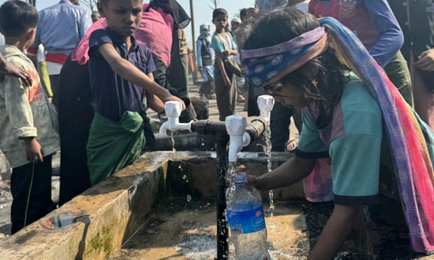 Rohingya children collect drinking water at a refugee camp in Cox’s Bazar, Bangladesh. Photograph: Shafiqur Rahman/AP