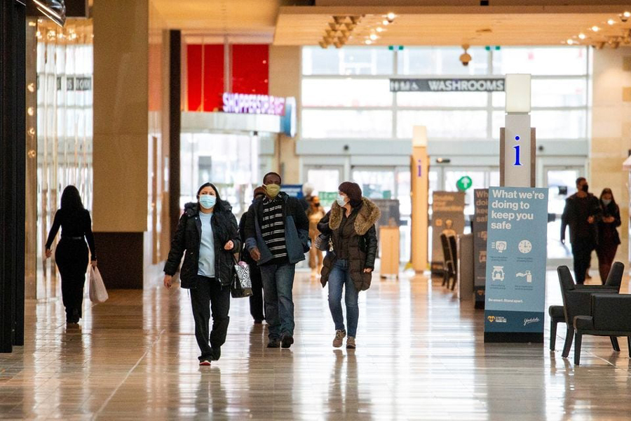 People walks inside Yorkdale Shopping Centre as the city enters the first day of a renewed coronavirus lockdown due to a spike in cases in Toronto, Ontario, Canada November 23, 2020.