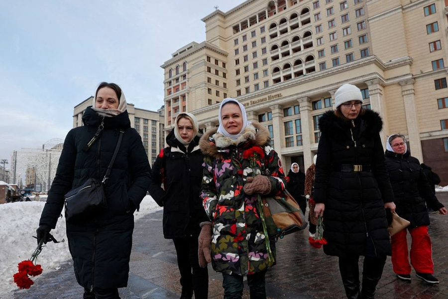 Maria Andreeva, whose husband was mobilised in October 2022 to join the Russian armed forces involved in a military campaign in Ukraine, and other wives of mobilised servicemen walk to lay flowers at the Tomb of the Unknown Soldier by the Kremlin wall in Moscow, Russia, January 20, 2024. Andreeva is an active member of Russian women's movement "Way Home", demanding the return from the frontline of their husbands, sons and brothers.