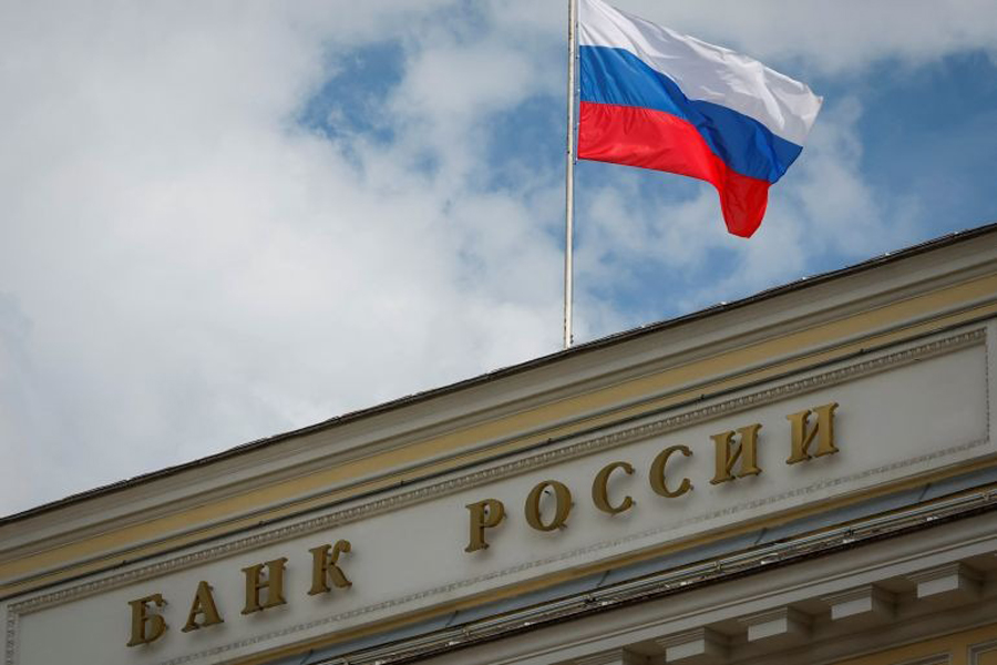 A Russian state flag flies over the Central Bank headquarters in Moscow on August 15, 2023.