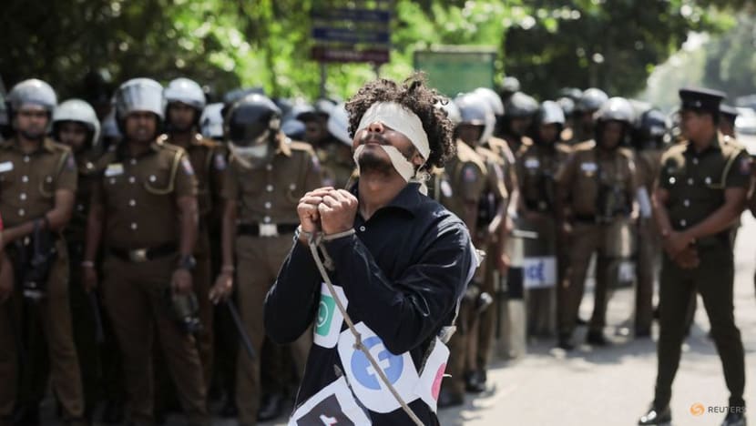An activist performs as he wears social media logos on his shirt during a protest near Sri Lanka's parliament as it readies to pass an Online Safety Bill, in Colombo, Sri Lanka on Jan 24, 2024. (Photo: REUTERS/Dinuka Liyanawatte)