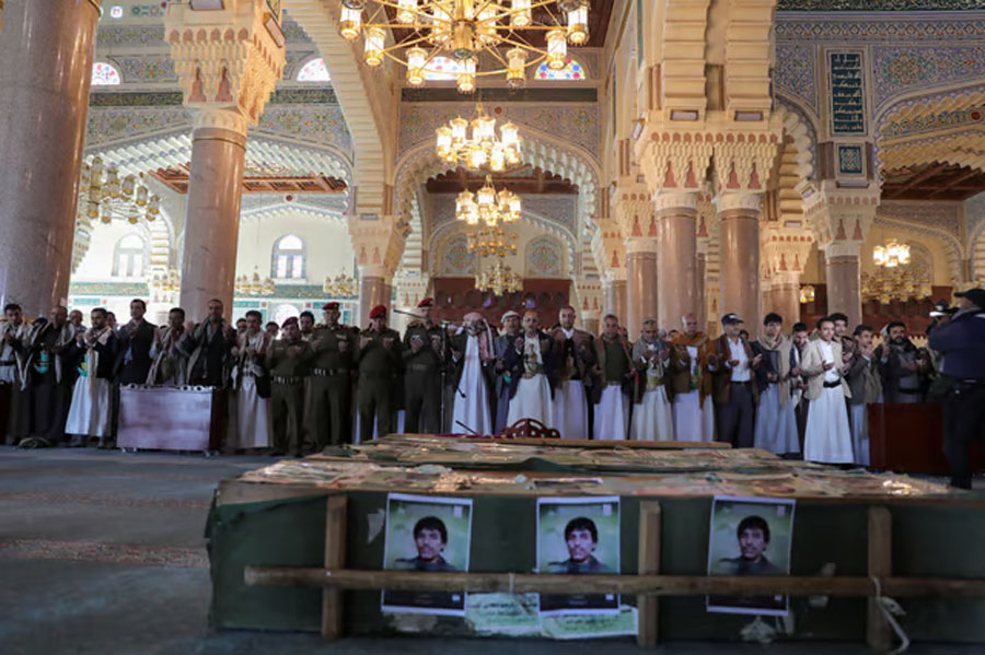 Mourners preform prayers in front of coffins of Houthi fighters killed in recent US-led strikes on Houthi targets, during their funeral in Sanaa, Yemen January 17, 2024. REUTERS/Khaled Abdullah