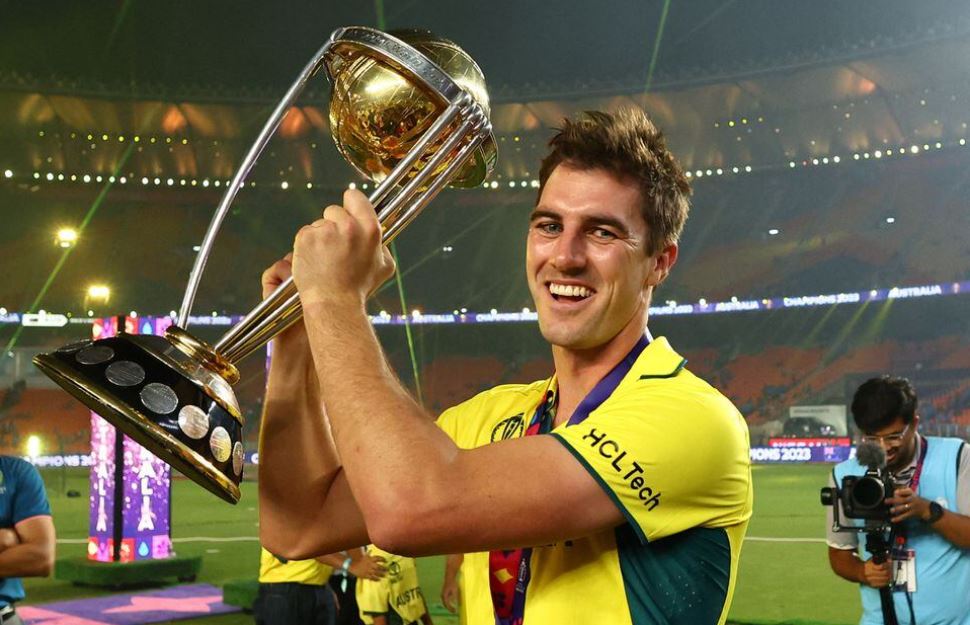 ICC Cricket World Cup 2023 - Final - India v Australia - Narendra Modi Stadium, Ahmedabad, India - November 19, 2023 Australia's Pat Cummins celebrates with the trophy after winning the ICC Cricket World Cup REUTERS/Andrew Boyers