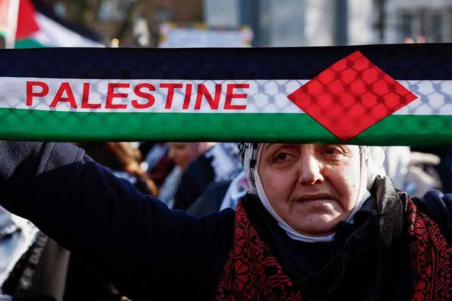 A pro-Palestinian protester holding a sign during a demonstration outside the International Court of Justice (ICJ) in The Hague, Netherlands, on Friday –Reuters photo
