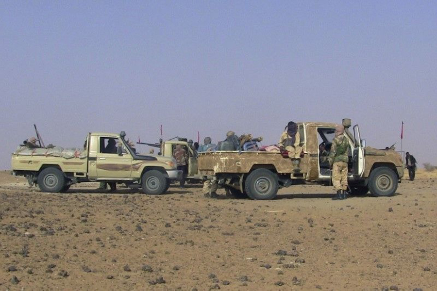 Fighters from the Tuareg separatist rebel group MNLA drive in the desert near Tabankort, February 15, 2015.