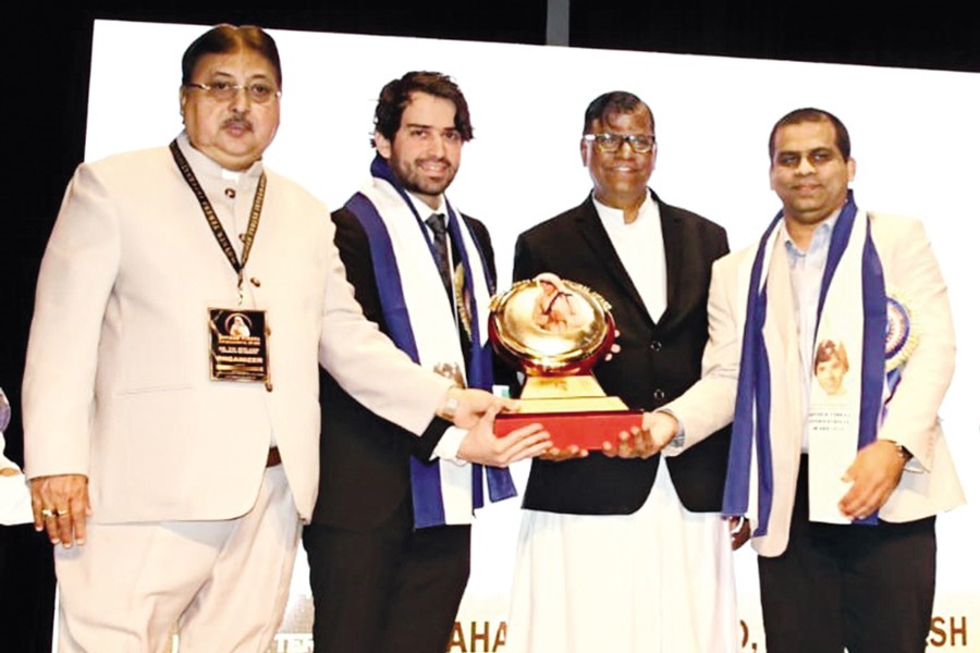 Mirza Ahmed Ispahani, director of Ispahani Group, receiving the prestigious 'International Mother Teresa Award 2024' on behalf of Ispahani Limited from Father Joy D Suzha (regional education commission, West Bengal and Sikkim) in Kolkata on Friday