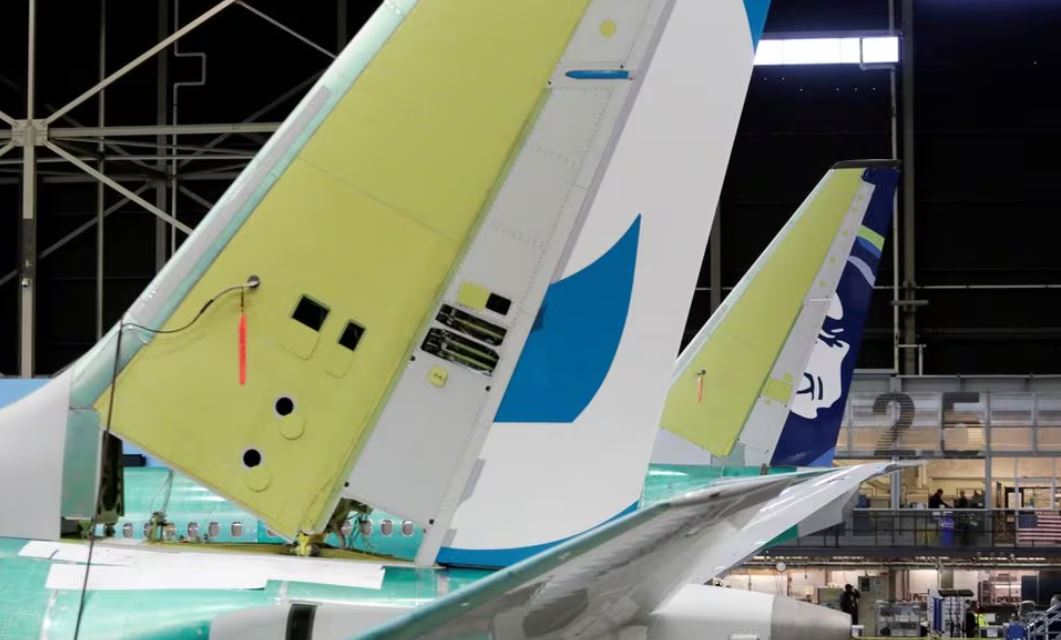 The tail of Boeing's new 737 MAX-9 (L) is pictured next to an older model under construction at their production facility in Renton, Washington, U.S., February 13, 2017. Picture taken February 13, 2017. REUTERS/Jason Redmond/File Photo
