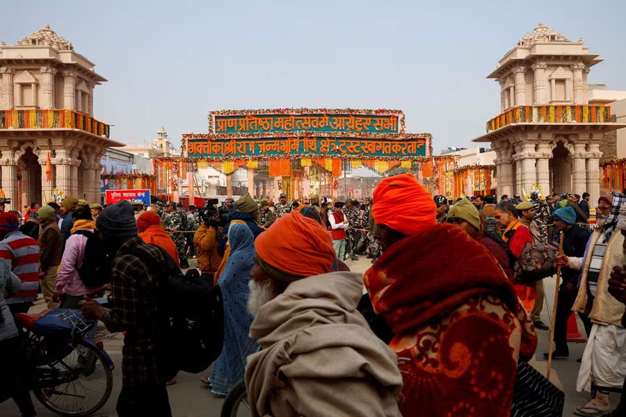 Hindu devotees wait to enter the Hindu god Lord Ram temple after its inauguration in Ayodhya, India, January 23, 2024.