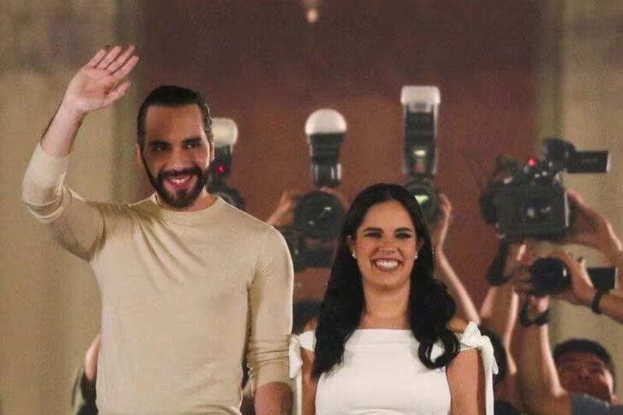 El Salvador's President, Nayib Bukele, who is running for reelection, greets supporters from the balcony of the National Palace next to his wife Gabriela de Bukele, after declaring himself the winner in the presidential election in San Salvador, El Salvador, February 4, 2024.