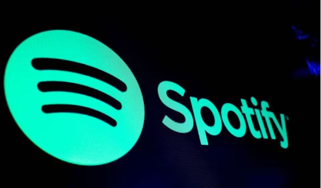 A screen displays the logo of Spotify on the floor at the New York Stock Exchange (NYSE) in New York City, U.S., December 4, 2023. REUTERS/Brendan McDermid/File Photo