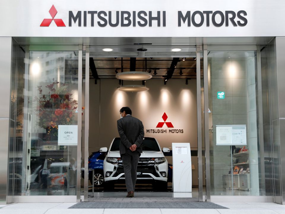 A man walks into a showroom of Mitsubishi Motors Corp at company headquarters in Tokyo, Japan October 18, 2017. REUTERS/Kim Kyung-Hoon